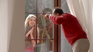 The young blonde girl has a cute face and she is